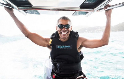 obama enjoys watersports with virgin chief on luxury island