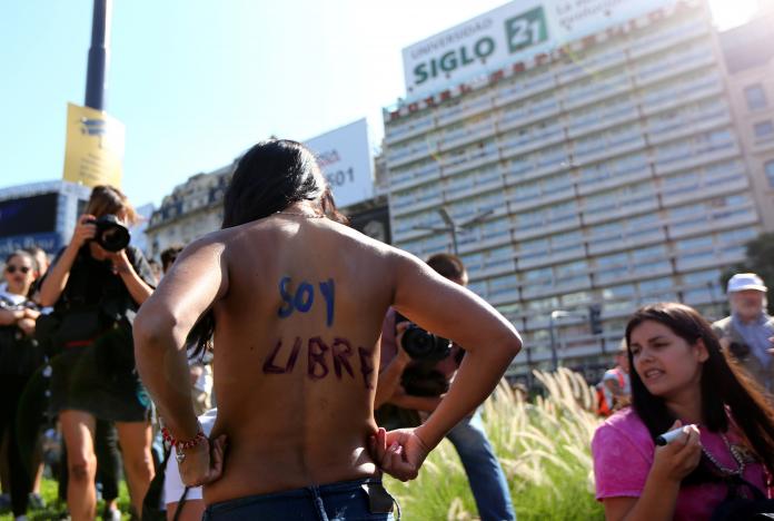 a woman poses topless with the words quot i am free quot written on her back during a protest in response to a recent incident on an argentine resort beach between police and topless sunbathers in downtown buenos aires argentina february 7 2017 photo reuters