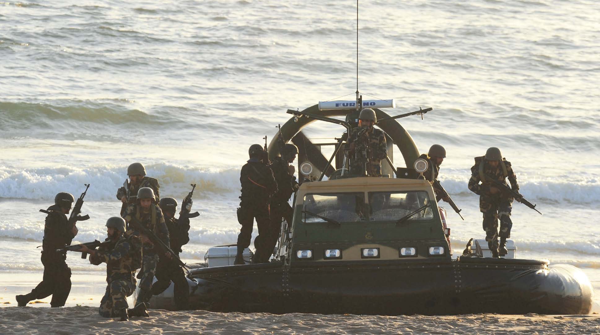 special services group naval commandos in action during the first day of the aman 11 multinational naval exercise photo afp