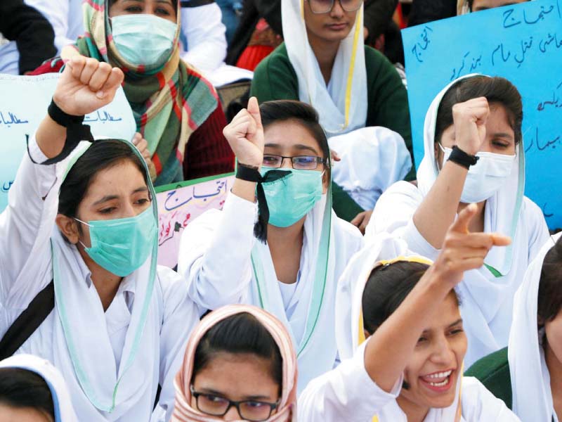 nurses of public hospitals shout slogans while staging a demonstration in support of their demands for better pay and up gradation of administrative posts outside the karachi press club on wednesday photo online
