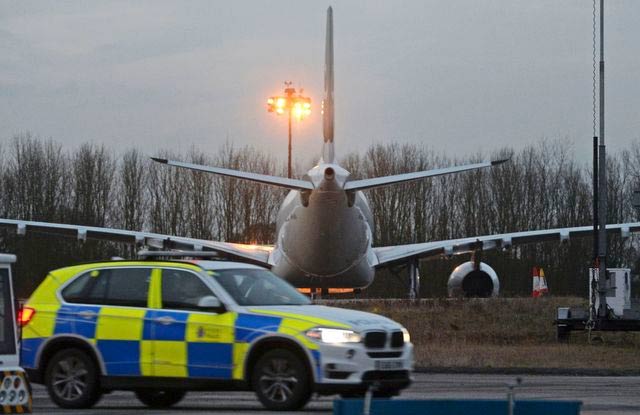 a police passes next to a pakistan international airlines aircraft that was intercepted and escorted by fighter jets to stansted airport northeast of london because of a disruptive passenger britain 039 s police said february 7 2017 photo reuters