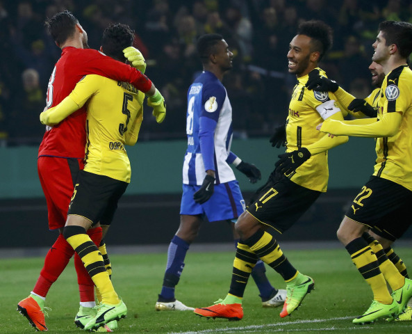 dortmund 039 s goalkeeper roman burki celebrates with teammates after winning the penalty shootout while berlin 039 s salomon kalou reacts photo reuters dortmund 039 s goalkeeper roman burki celebrates with teammates after winning the penalty shootout while berlin 039 s salomon kalou reacts photo reuters