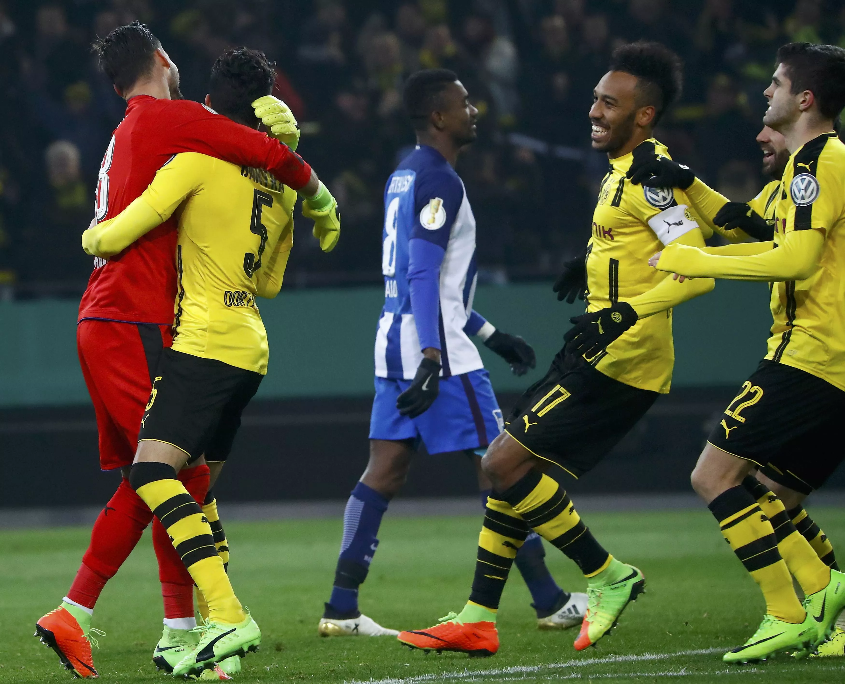dortmund 039 s goalkeeper roman burki celebrates with teammates after winning the penalty shootout while berlin 039 s salomon kalou reacts photo reuters dortmund 039 s goalkeeper roman burki celebrates with teammates after winning the penalty shootout while berlin 039 s salomon kalou reacts photo reuters