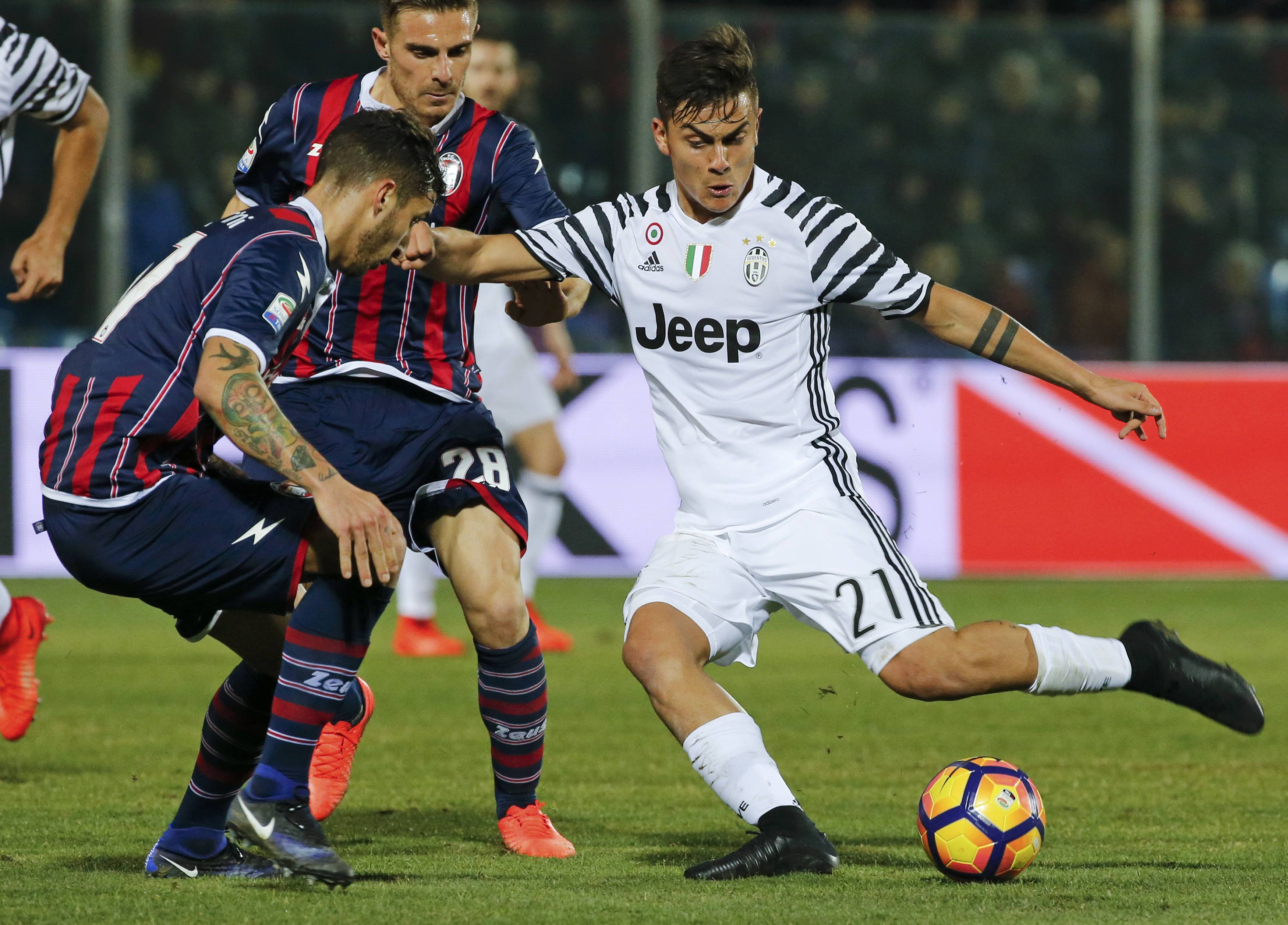 juventus 039 paulo dybala against crotone 039 s federico ceccherini and leonardo capezzi photo reuters