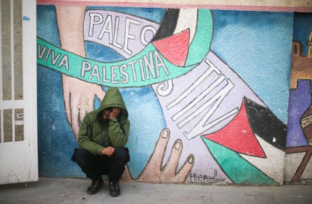 a relative of one of the two palestinians who were killed in a bombing of a tunnel near the egyptian border reacts at a hospital in rafah in the southern gaza strip february 9 2017 photo reuters