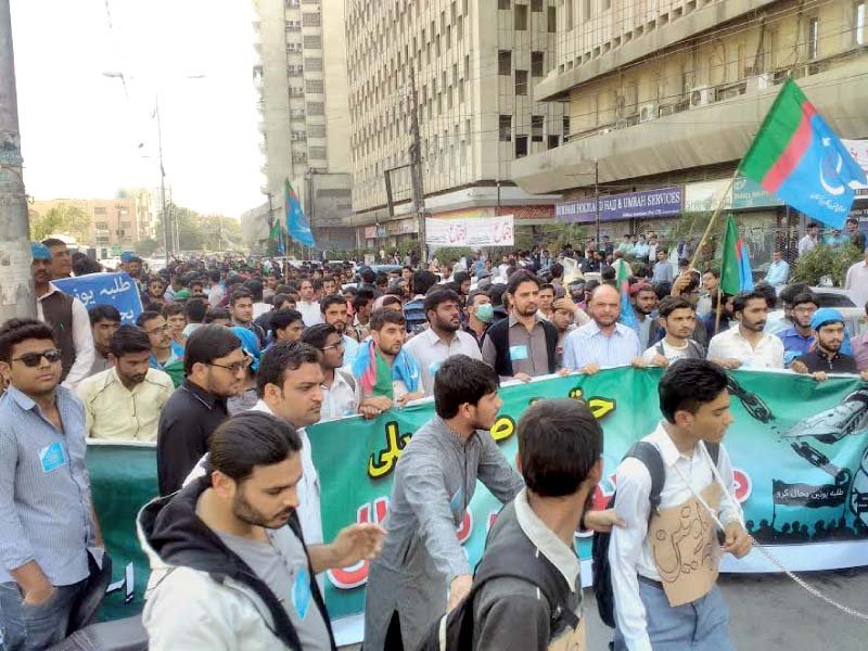 students hold placards as they shout slogans in favour of the revival of students unions photo express