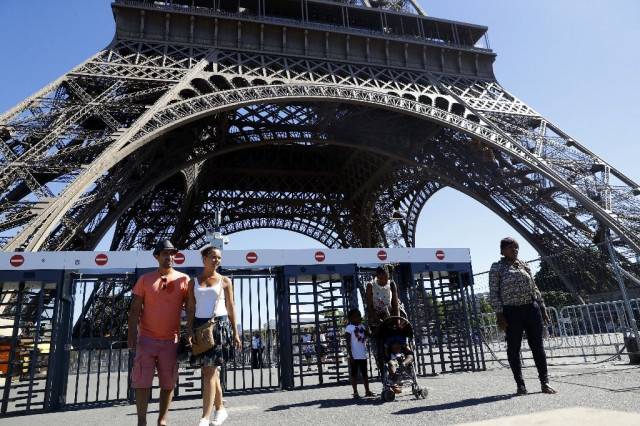 a glass wall will replace metal fences around the eiffel tower photo afp a glass wall will replace metal fences around the eiffel tower photo afp