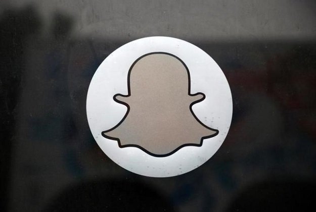 the snapchat logo is seen on the door of their headquarters in venice los angeles california october 13 2014 photo reuters