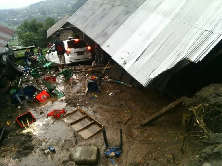 villagers attempt to salvage their belongings from a house damaged in a landslide in kintamani bali province photo afp villagers attempt to salvage their belongings from a house damaged in a landslide in kintamani bali province photo afp