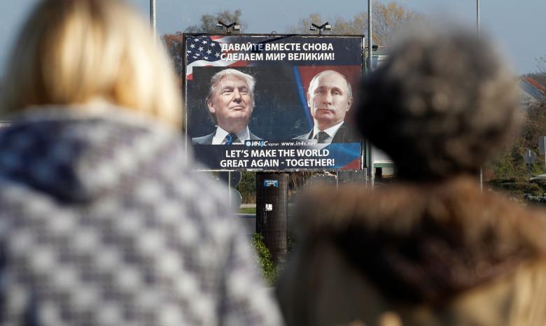 a billboard showing a pictures of us president elect donald trump and russian president vladimir putin is seen through pedestrians in danilovgrad montenegro photo reuters