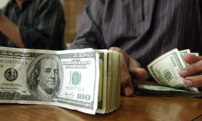 a pakistani currency dealer counts us dollars at a currency exchange shop photo afp a pakistani currency dealer counts us dollars at a currency exchange shop photo afp