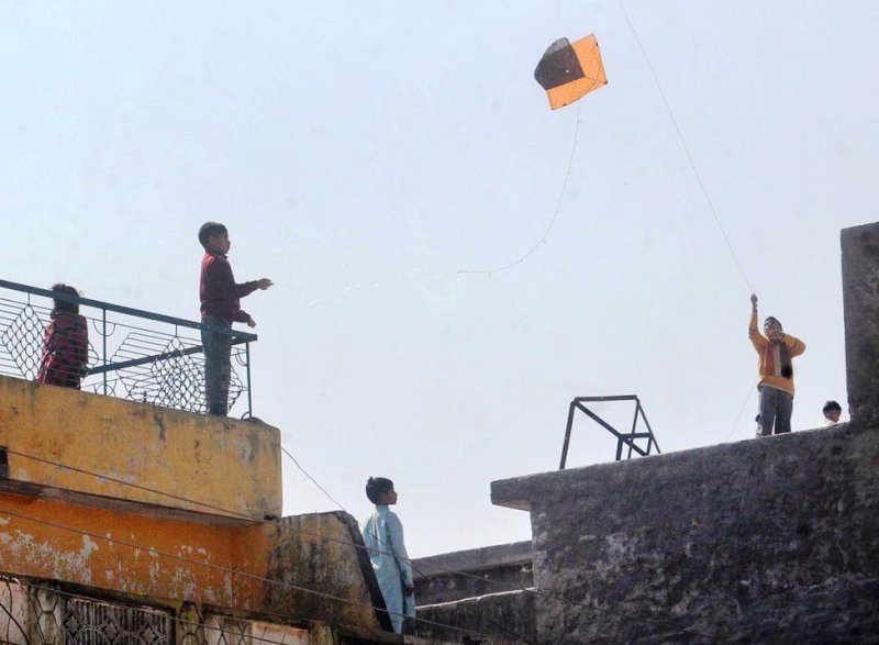 file photo of children flying kites photo app file
