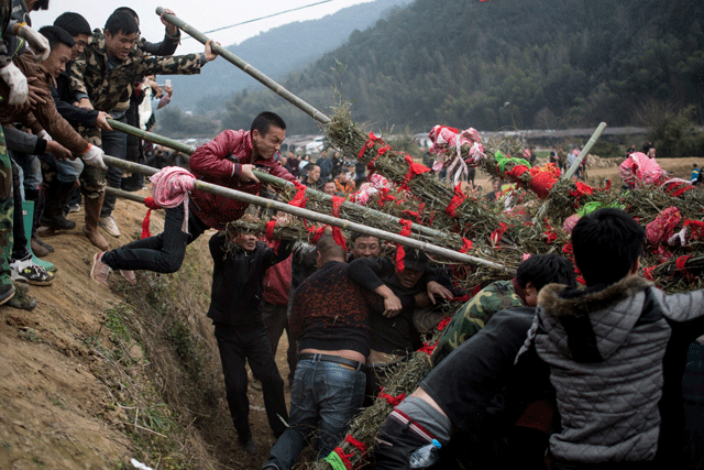 picture shows villagers taking part in the quot beat the buddha quot celebration in yuxi village photo afp