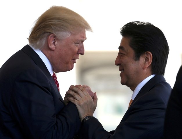 japanese prime minister shinzo abe is greeted by u s president donald trump l ahead of their joint news conference at the white house in washington u s february 10 2017 photo reuters