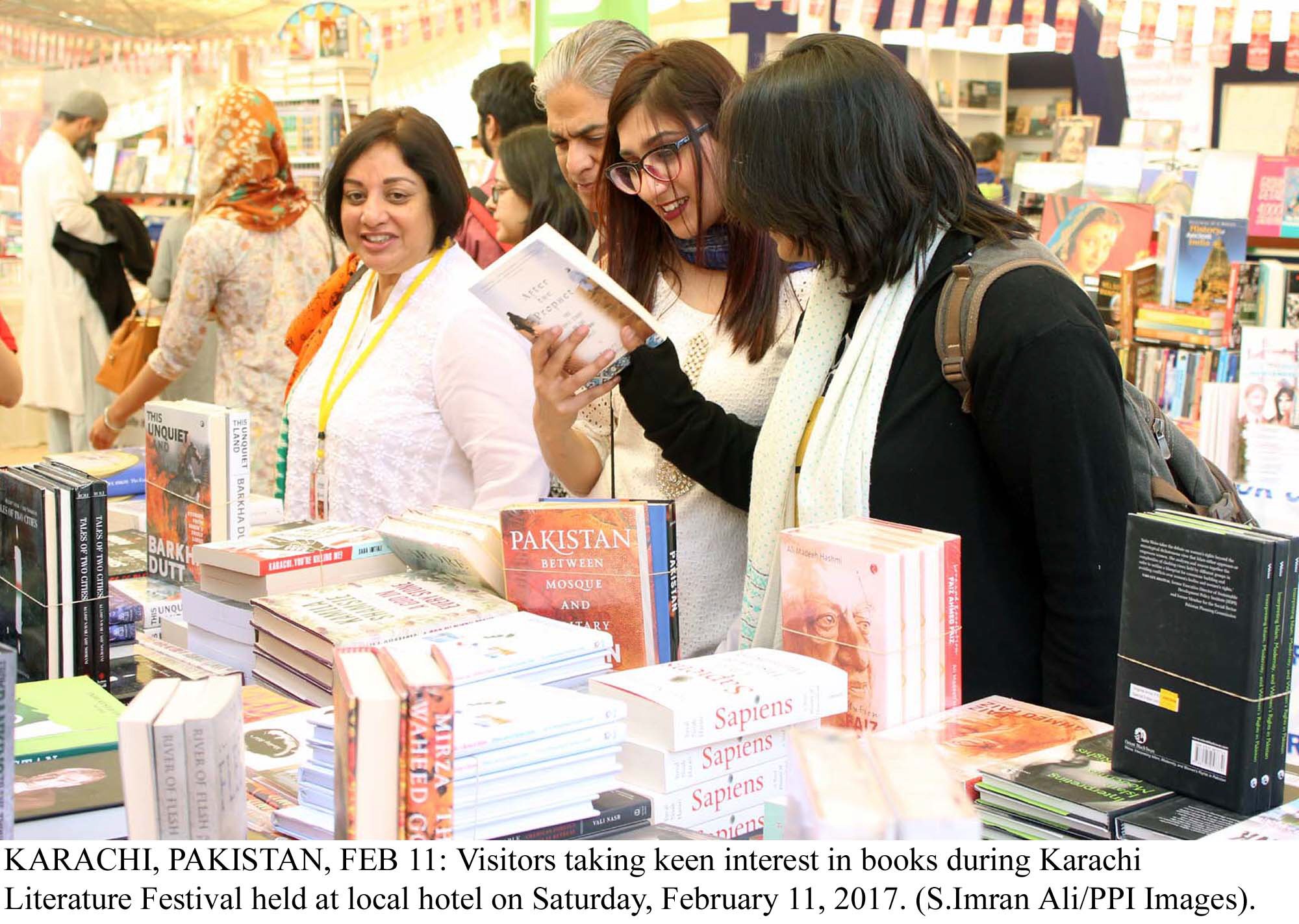 visitors taking keen interest in books during karachi literature festival photo ppi