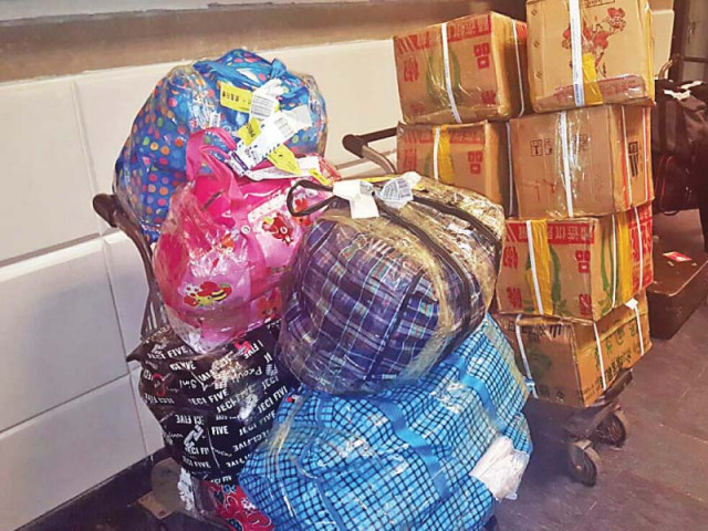 bundles of over 400kg confiscated pork are stacked at islamabad airport photo express bundles of over 400kg confiscated pork are stacked at islamabad airport photo express