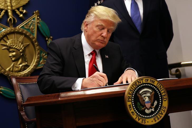 us president donald trump signs an executive order to impose tighter vetting of travelers entering the united states at the pentagon in washington u s photo reuters