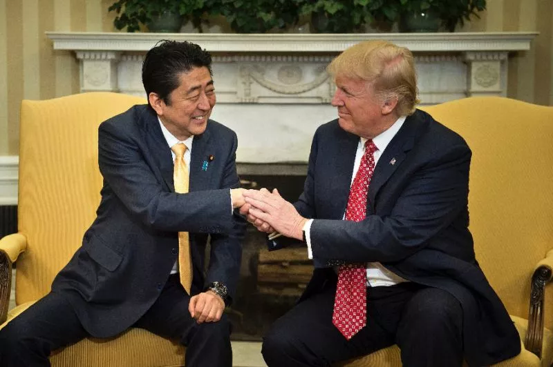 us president donald trump praised japanese prime minister shinzo abe 039 s quot strong hands quot after greeting him with a hug at the white house photo afp us president donald trump praised japanese prime minister shinzo abe 039 s quot strong hands quot after greeting him with a hug at the white house photo afp