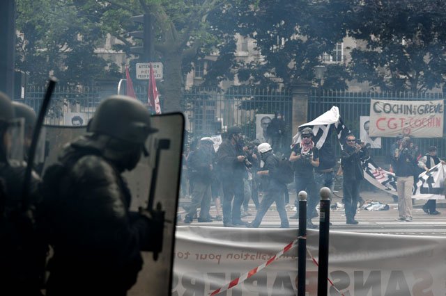 demonstrators clash with police officers during a protest against proposed labour reforms in paris on june 14 2016 photo afp
