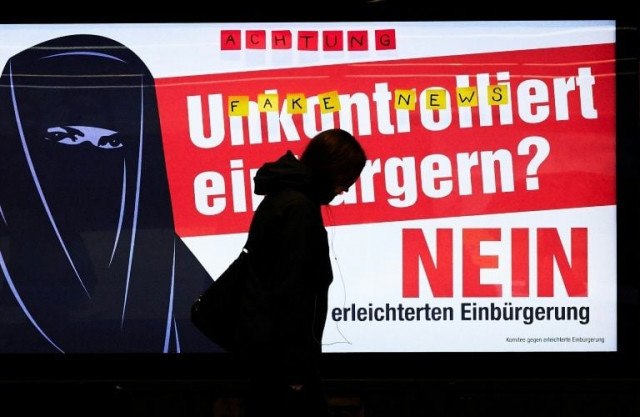 people walk by an electoral poster at zurich station which reads quot uncontrolled citizenship no quot ahead of a vote on citizenship photo afp people walk by an electoral poster at zurich station which reads quot uncontrolled citizenship no quot ahead of a vote on citizenship photo afp