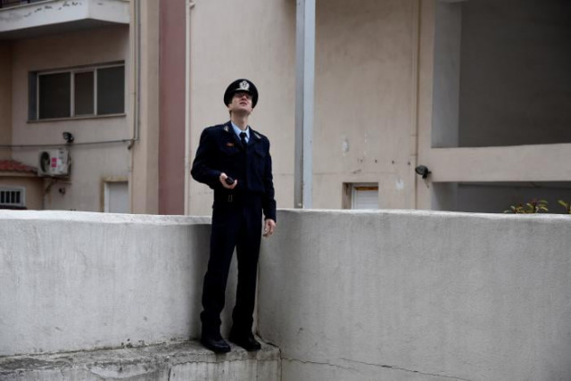 a police officer checks the nearby apartment buildings for residents who have not evacuated before an operation to defuse a 250 kg world war two bomb found during excavation works at a gas station on the northern city of thessaloniki greece february 12 2017 photo reuters a police officer checks the nearby apartment buildings for residents who have not evacuated before an operation to defuse a 250 kg world war two bomb found during excavation works at a gas station on the northern city of thessaloniki greece february 12 2017 photo reuters