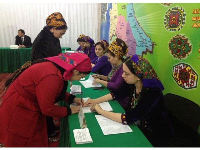 a woman signs to collect her ballot during a presidential election at a polling station in ashgabat turkmenistan february 12 2017 photo reuters