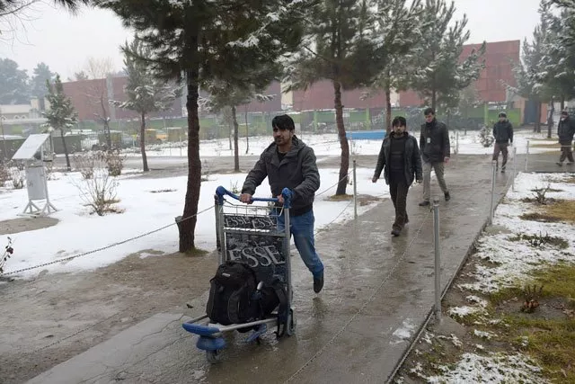 in this photograh taken on january 24 2017 afghan refugee atiqullah akbari 23 and who has been deported from germany arrives at the international airport in kabul photo afp in this photograh taken on january 24 2017 afghan refugee atiqullah akbari 23 and who has been deported from germany arrives at the international airport in kabul photo afp