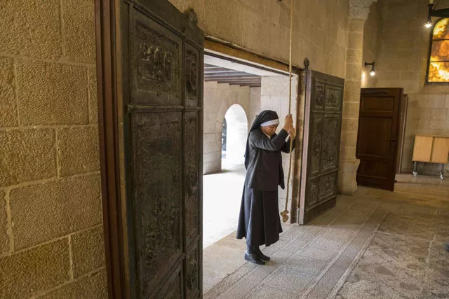 a nun rings the bell for a mass at the loaves 039 church in israel photo afp a nun rings the bell for a mass at the loaves 039 church in israel photo afp