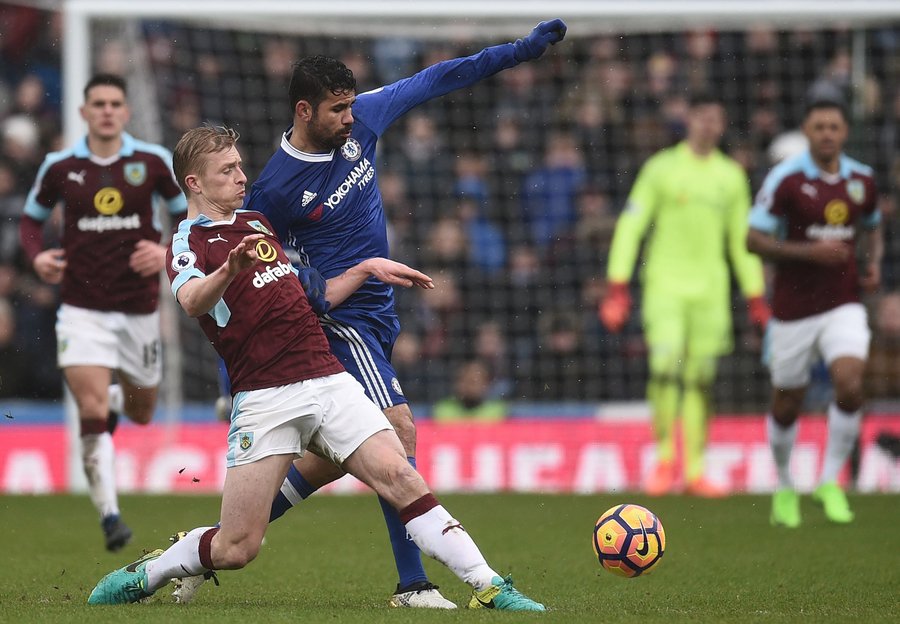 burnley 039 s english defender ben mee vies with chelsea 039 s brazilian born spanish striker diego costa 3rd l during the english premier league football match between burnley and chelsea at turf moor in burnley north west england on february 12 2017 photo afp