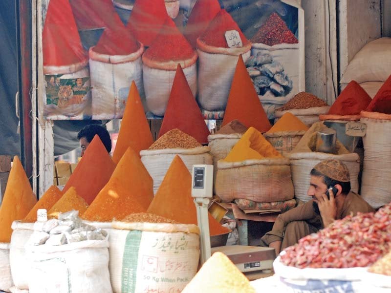 a shopkeeper sells unpacked spices at his shop in sargodha sale of loose food is a routine all over the country photo file