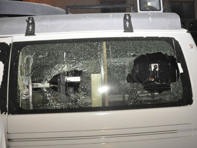 the broken glass of the attacked dsng van photo express