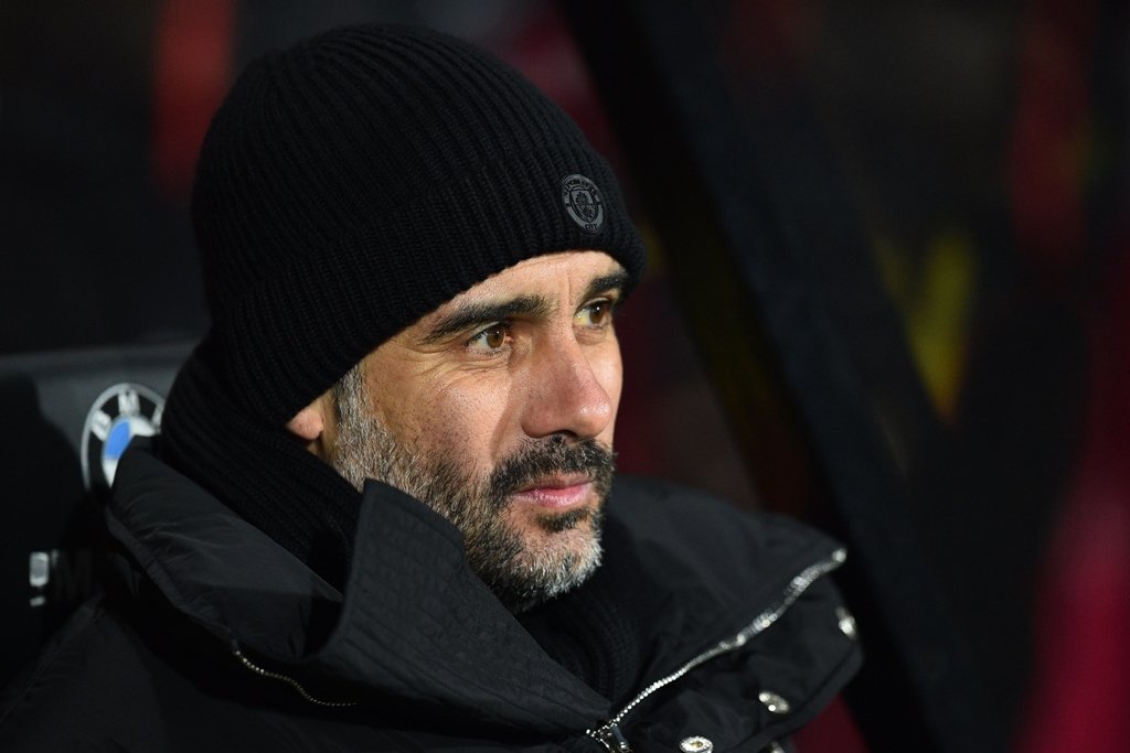 manchester city manager pep guardiola awaits kick off against bournemouth on february 13 2017 photo afp