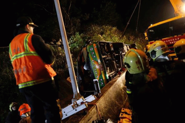 rescuers gather around a crashed bus in taipei taiwan february 13 2017 photo reuters rescuers gather around a crashed bus in taipei taiwan february 13 2017 photo reuters