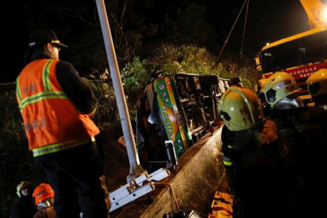 rescuers gather around a crashed bus in taipei taiwan february 13 2017 photo reuters