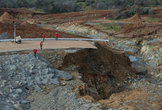 california department of water resources crews inspect and evaluate the erosion just below the lake oroville emergency spillway site after lake levels receded in oroville california us february 13 2017 photo reuters
