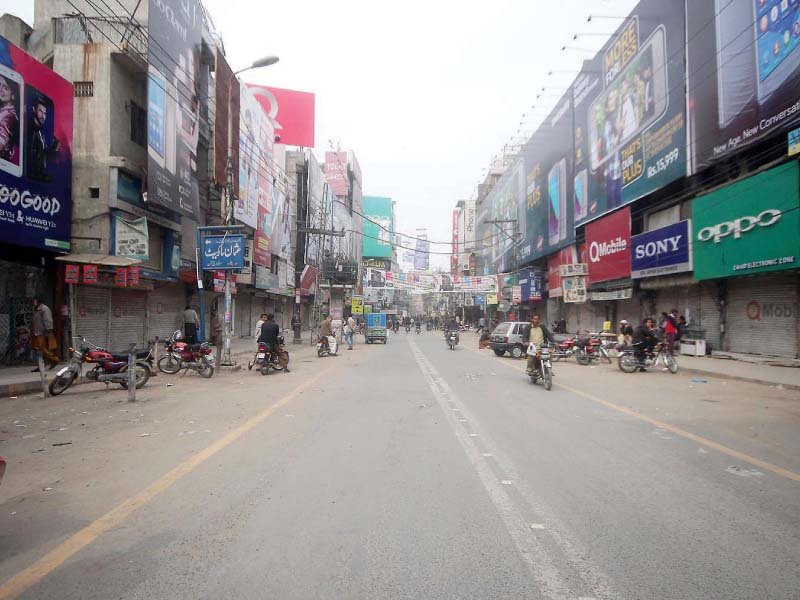 the mini market on hall road wears a deserted look as people are still reeling from monday s suicide blast over 50 people still lie injured in various hospitals of lahore photo abid nawaz express