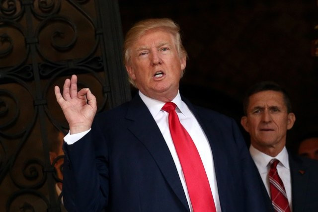 u s president elect donald trump talks to members of the media as retired u s army lieutenant general michael flynn stands next to him at mar a lago estate photo reuters u s president elect donald trump talks to members of the media as retired u s army lieutenant general michael flynn stands next to him at mar a lago estate photo reuters