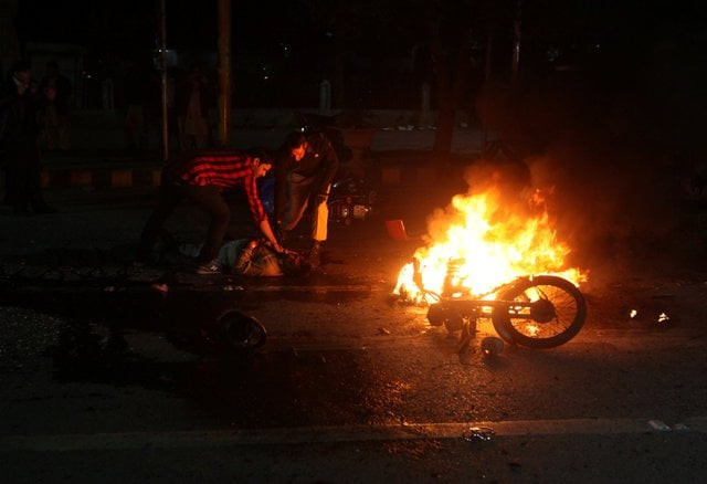 people check the condition of a victim after a blast in lahore pakistan february 13 2017 photo reuters people check the condition of a victim after a blast in lahore pakistan february 13 2017 photo reuters