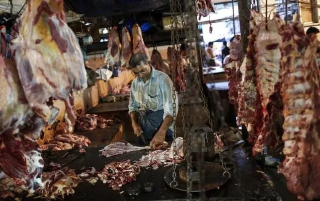 a butcher cuts up portions of beef for sale in an abattoir at a wholesale market in mumbai may 11 2014 photo reuters a butcher cuts up portions of beef for sale in an abattoir at a wholesale market in mumbai may 11 2014 photo reuters