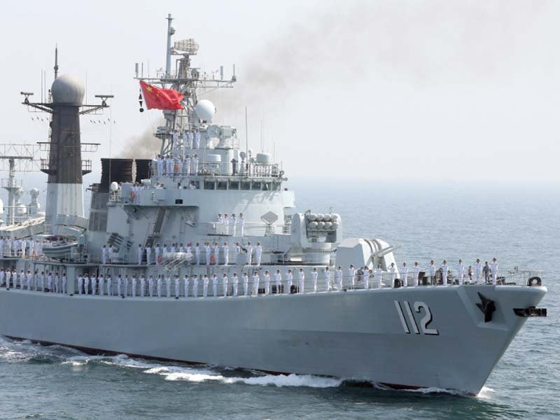 chinese servicemen gesture from the deck of a naval vessel during the closing ceremony of the aman 17 in the north arabian sea photo reuters