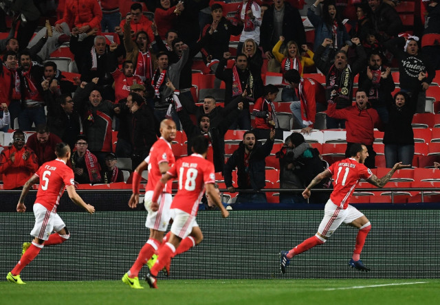 striker kostas mitroglou scored the only goal of the game as benfica go into last 16 s second leg with an advantage photo afp
