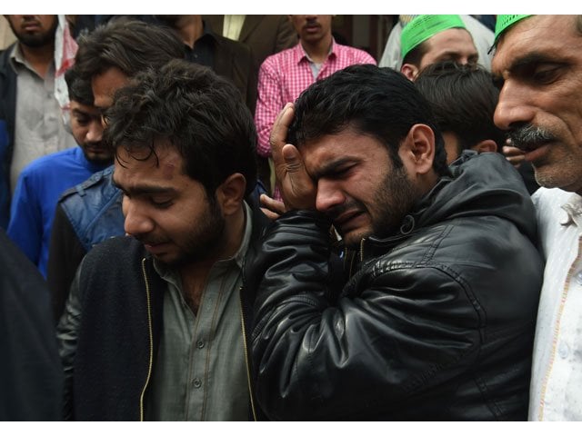 relatives mourn the death of a blast victim during a funeral ceremony in lahore on february 14 2017 photo afp