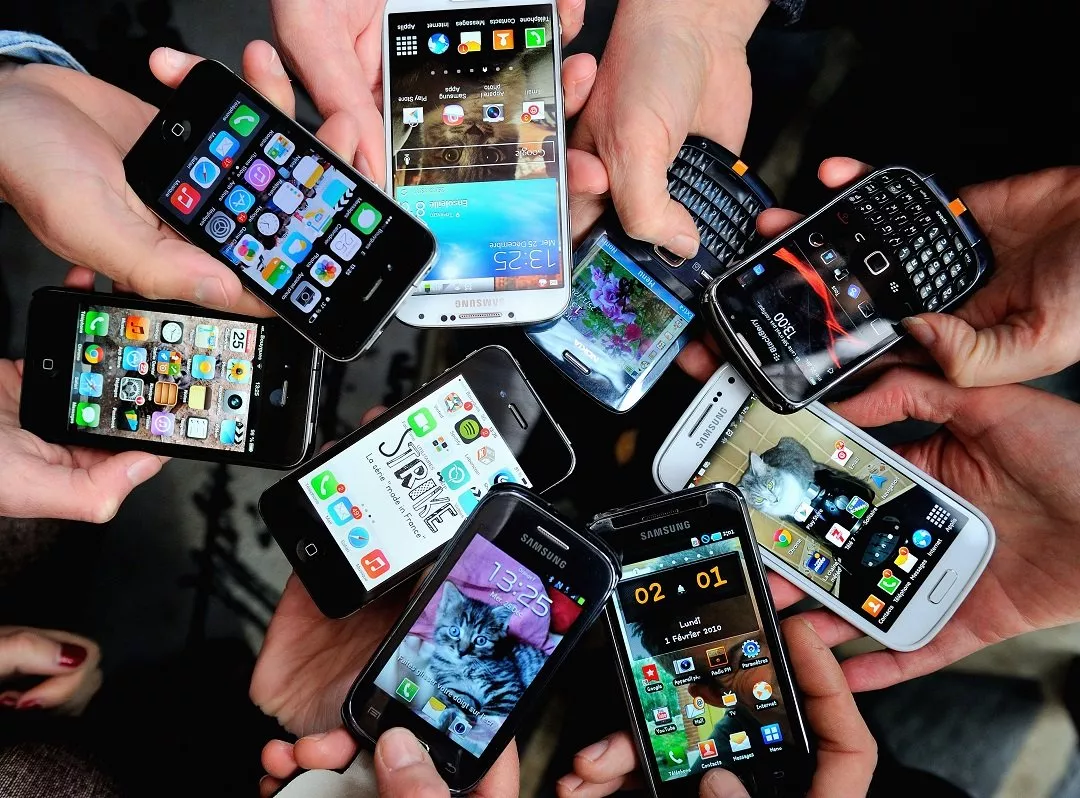 people show their smartphone photo afp people show their smartphone photo afp