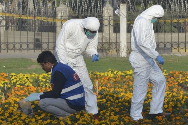 security officials collect evidence at the site of a suicide bombing in lahore on february 14 2017 photo afp security officials collect evidence at the site of a suicide bombing in lahore on february 14 2017 photo afp