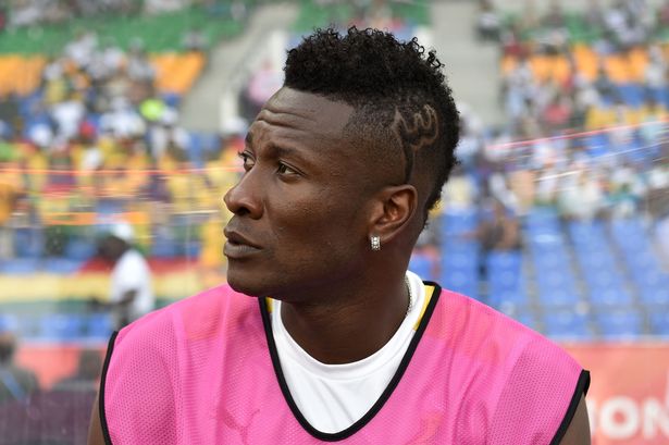 ghana striker asamoah gyan is among 46 players who have breached hairstyle rule photo afp