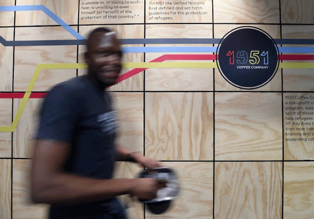 employee nicholas webaza a refugee from uganda works at 1951 coffee company in berkeley california february 9 2017 photo afp employee nicholas webaza a refugee from uganda works at 1951 coffee company in berkeley california february 9 2017 photo afp