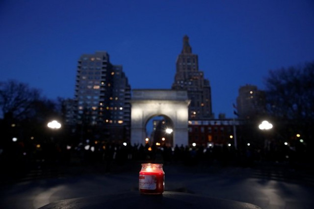 a candle is seen as demonstrators gather at washington square park to protest against u s president donald trump in new york us january 25 2017 photo reuters a candle is seen as demonstrators gather at washington square park to protest against u s president donald trump in new york us january 25 2017 photo reuters