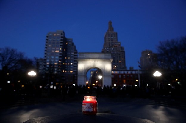 a candle is seen as demonstrators gather at washington square park to protest against u s president donald trump in new york us january 25 2017 photo reuters