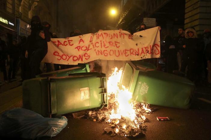 trash burns on the street as people hold a banner that reads quot in face of police impunity lets be ungovernable quot to protest police brutality after a young black man 22 year old youth worker named theo was severly injured during his arrest earlier this month in bobigny as they gather at a demonstration in paris france february 15 2017 photo reuters