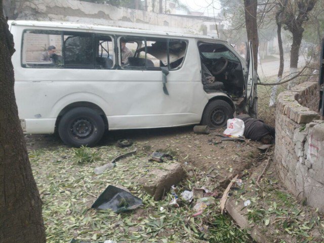 the blast targeted a government van a 5597 while it was on its way to judges colony in the hayatabad peshawar photo iftikhar firdous